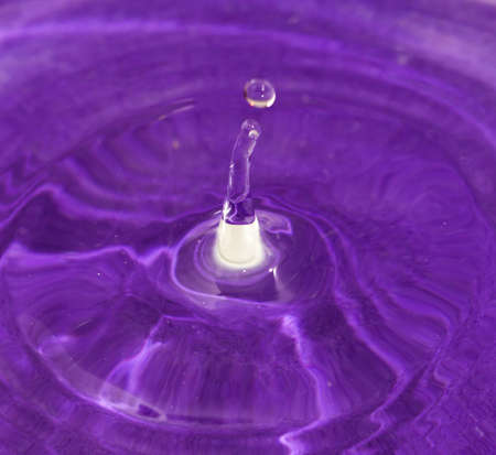 drops fall into the water. beautiful backgroundの写真素材