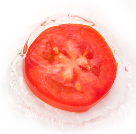 tomato in water on white backgroundの写真素材