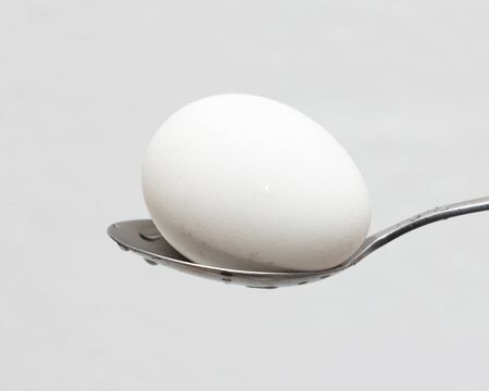 egg on a spoonの写真素材
