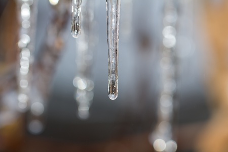 Thawing iciclesの写真素材