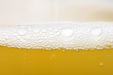 background of yellow beer. macroの写真素材