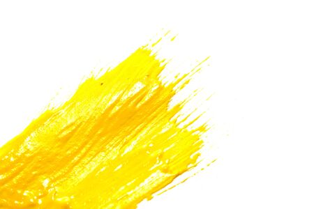 yellow gouache on white background.の写真素材