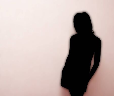 brunette girl on a pink backgroundの写真素材