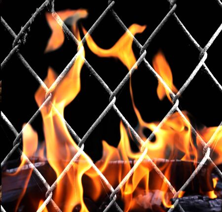 rusty metal grid on a black backgroundの写真素材