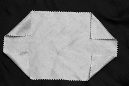 white cloth on a black background
