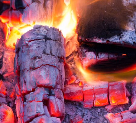 burning charcoal in the background