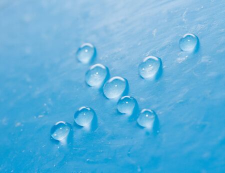 drops of water on a blue background. macro