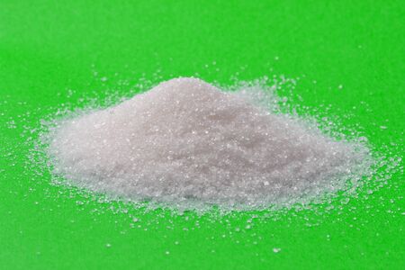 sugar on a green background. macroの写真素材