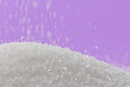 Sugar on a purple background. macroの写真素材