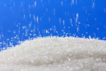 sugar on a blue background. macro