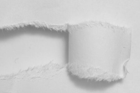 Hole ripped non color paper. White background