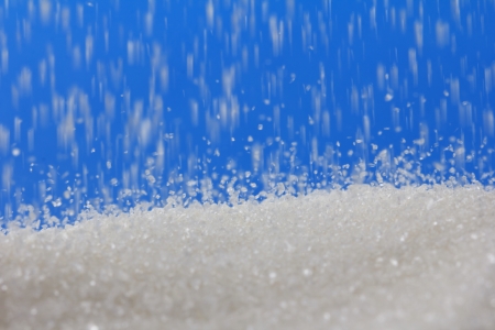 sugar on a blue background. macroの写真素材