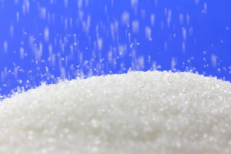 sugar on a blue background. macroの写真素材