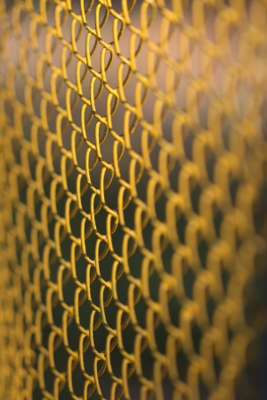 background of yellow metal meshの写真素材