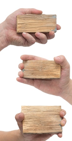 Wooden board sign on hand isolate on whiteの写真素材