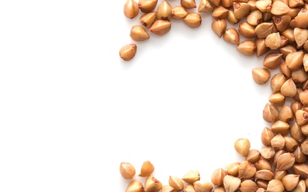 a little pile of buckwheat isolated on whiteの写真素材