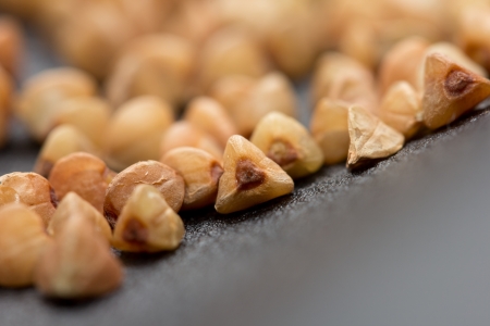 Buckwheat on black skin. macroの写真素材