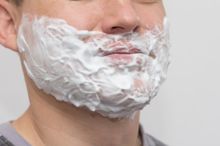 man shavesの写真素材