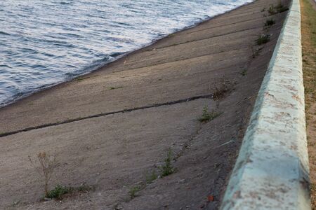 water in the concrete damの写真素材