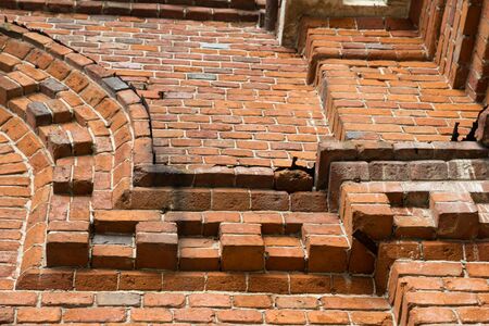 background of an old wall with red bricksの写真素材