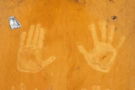 hand prints on an orange backgroundの写真素材