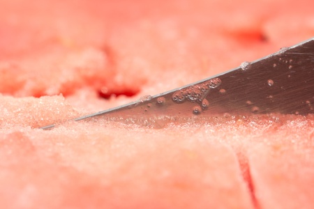 background of red watermelon with a knife. macroの写真素材