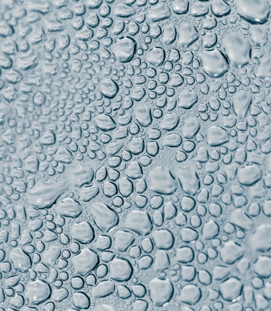 Background of water drops on the glassの写真素材