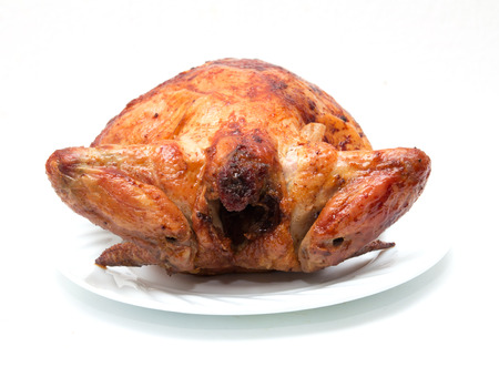 grilled chicken on a plate on a white backgroundの写真素材