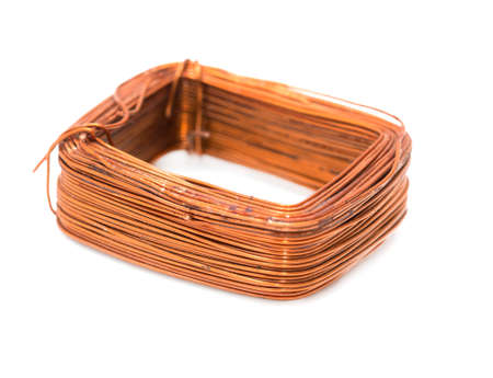 a coil of copper wire on a white backgroundの写真素材