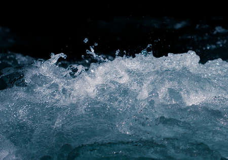 rough water with a splash as a backgroundの写真素材