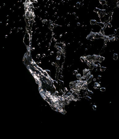 Water splashes on a black background