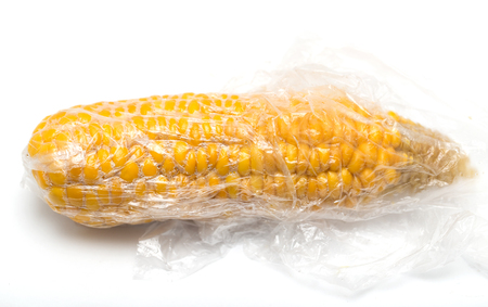 Corn on the package on a white backgroundの写真素材