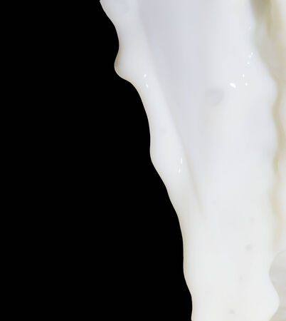 milk on a black backgroundの写真素材