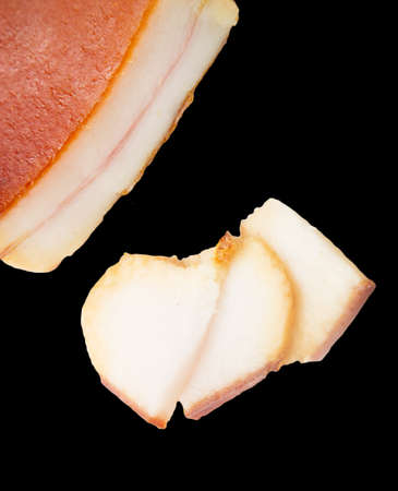 smoked bacon on a black backgroundの写真素材