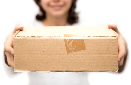 girl with a box on a white backgroundの写真素材