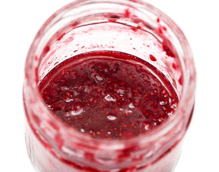 background of raspberry jam in a jar. macroの写真素材