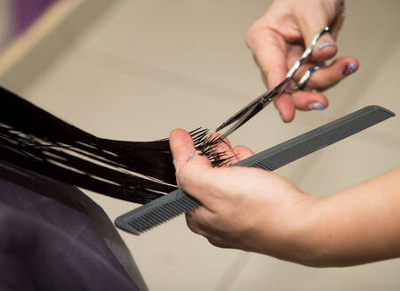 Women's haircut scissors at salonの写真素材
