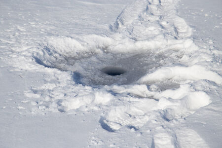 hole on the iceの写真素材