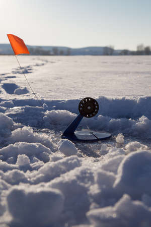 Fishing line in hole drilled in iceの写真素材