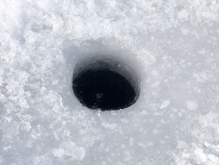 hole on the iceの写真素材