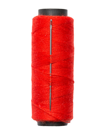 red thread with a needle on a white background. macro