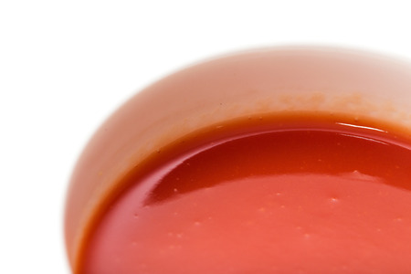 tomato juice in glass on white backgroundの写真素材