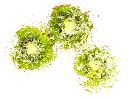 juicy kiwi fruit in water on a white background. macroの写真素材