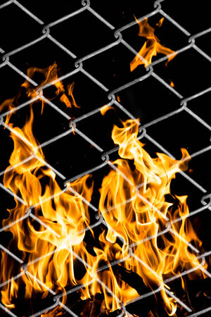 fire in a metal gridの写真素材