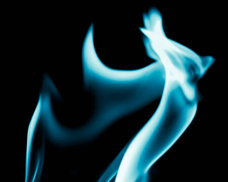 abstract background of blue flame fire on black backgroundの写真素材