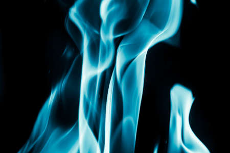 abstract background of blue flame fire on black backgroundの写真素材