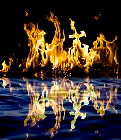 fire with reflection on waterの写真素材