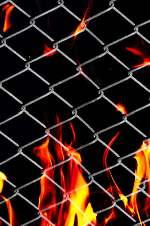 fire in a metal gridの写真素材