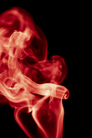 red smoke on black backgroundの写真素材