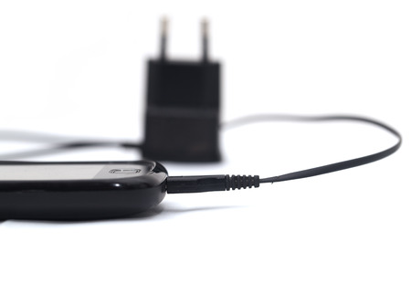 phone with an adapter on a white background